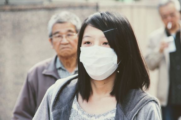 Femme portant un masque de protection - Chine